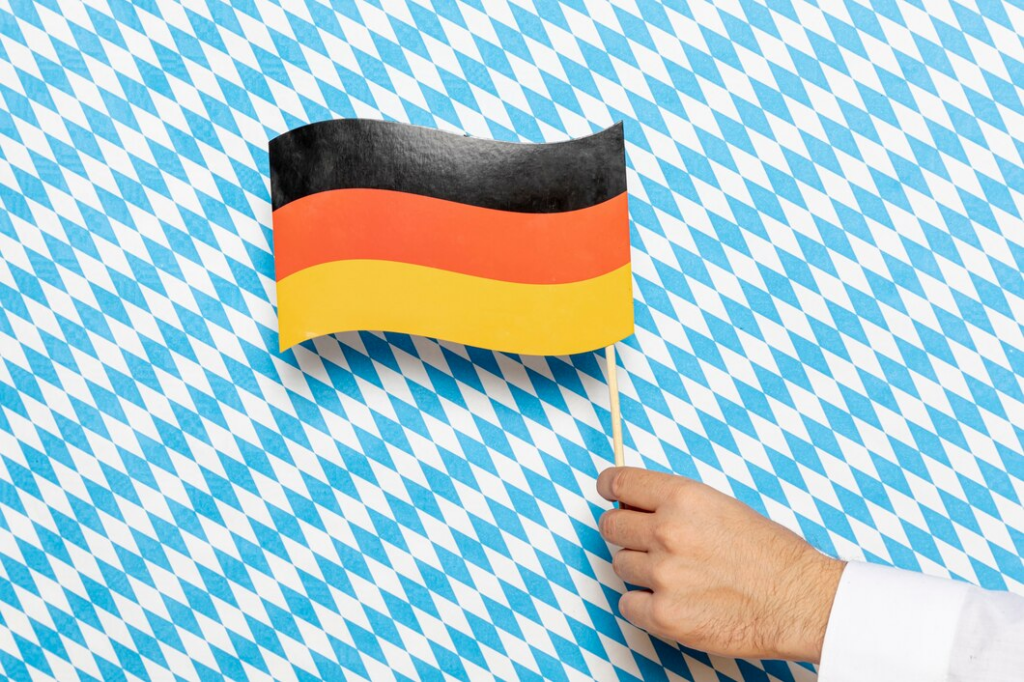 Man holding german flag with patterned background