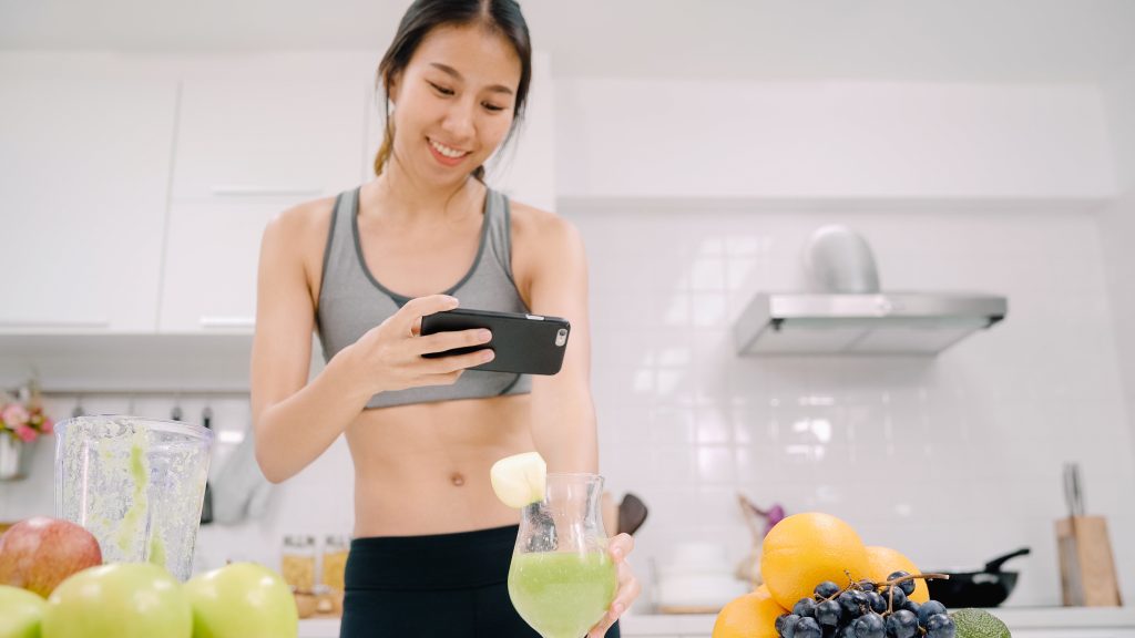 An influencer recording a video of a product she bought