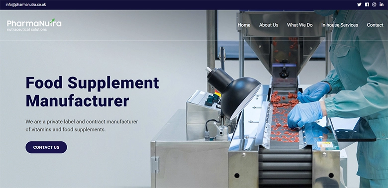 Screenshot of the PharmaNutra website with the headline “Food Supplement Manufacturer” and a production line showing capsules being handled.